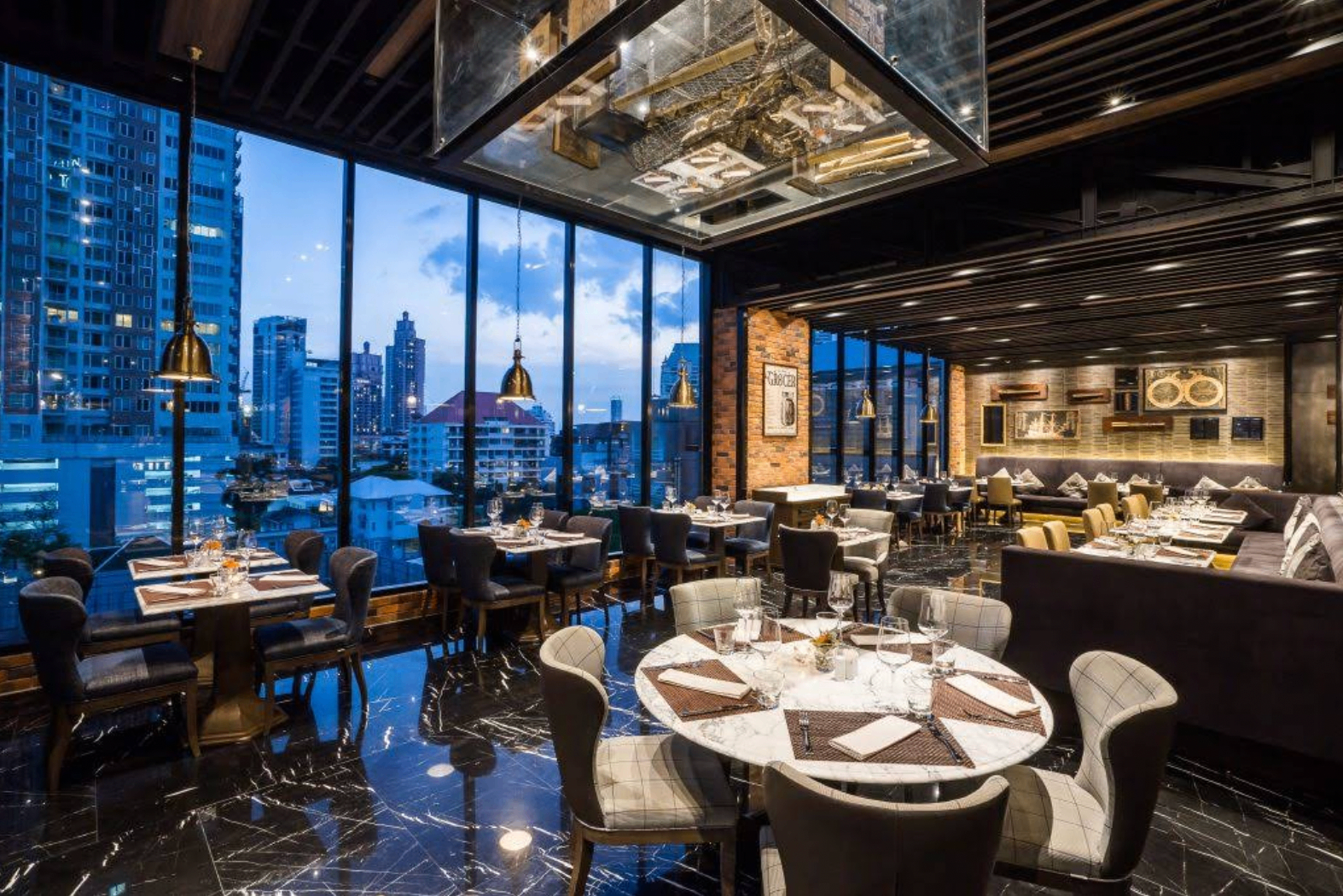 PRIME dining room with city view and marble tables